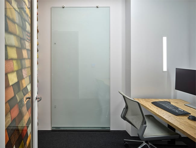 a glass panel reused as a marker board in the Neumann Monson Iowa City studio