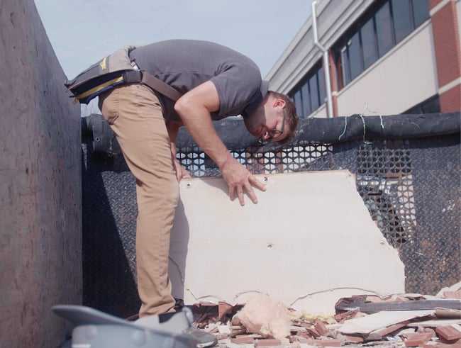 an architect inspecting demolition work on a construction site
