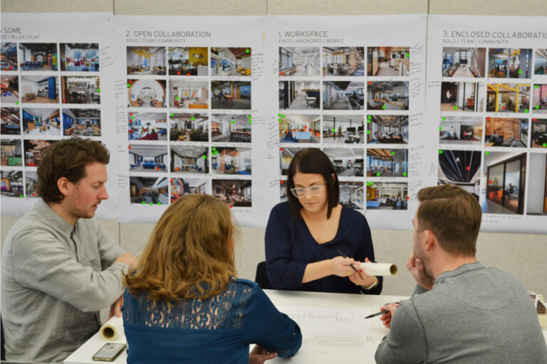 employees looking at design options