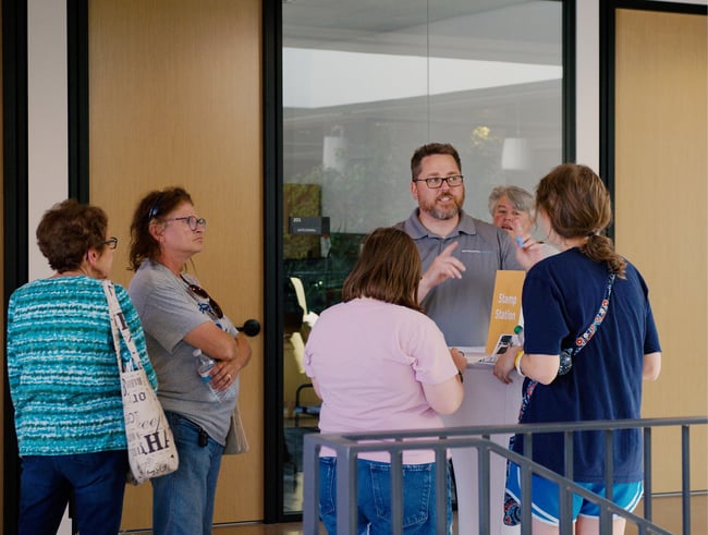 an architect giving a building tour during a public open house